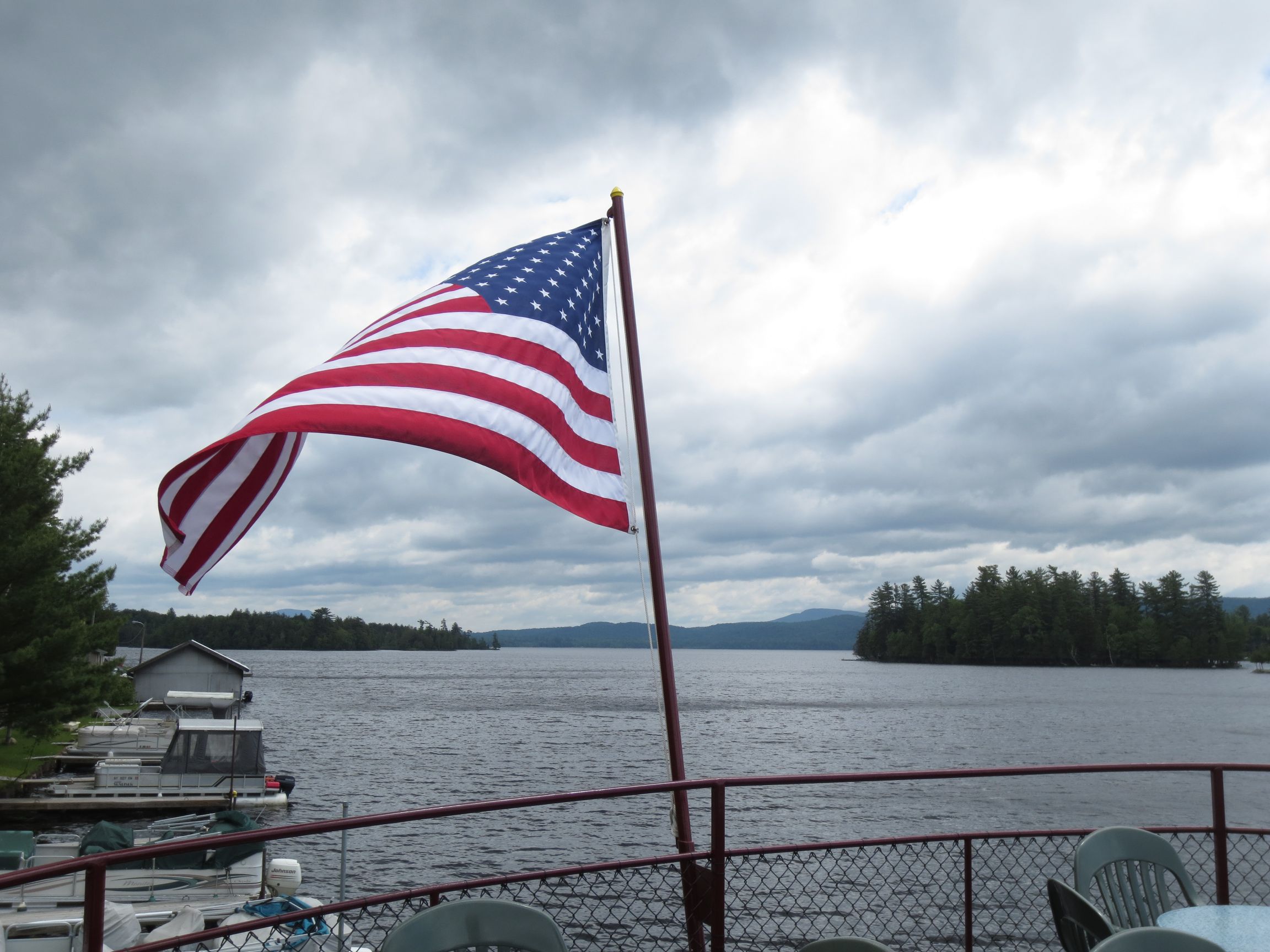 The American flag flying off the back of the WW Durant on Raquette Lake, New York The American flag flying off the back of the WW Durant on Raquette Lake, New York